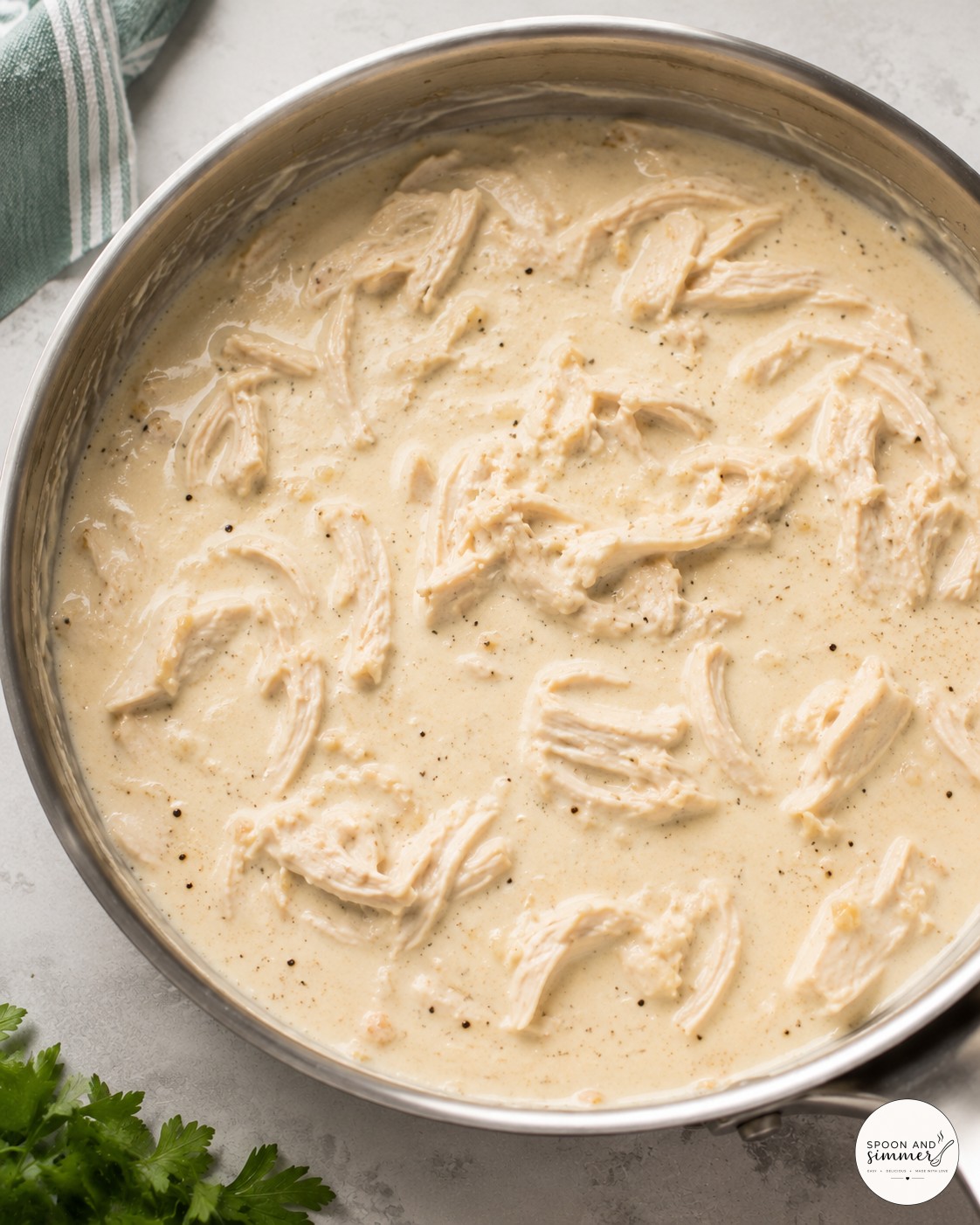 Seared chicken pieces turning golden in the skillet during white chicken skillet lasagna prep