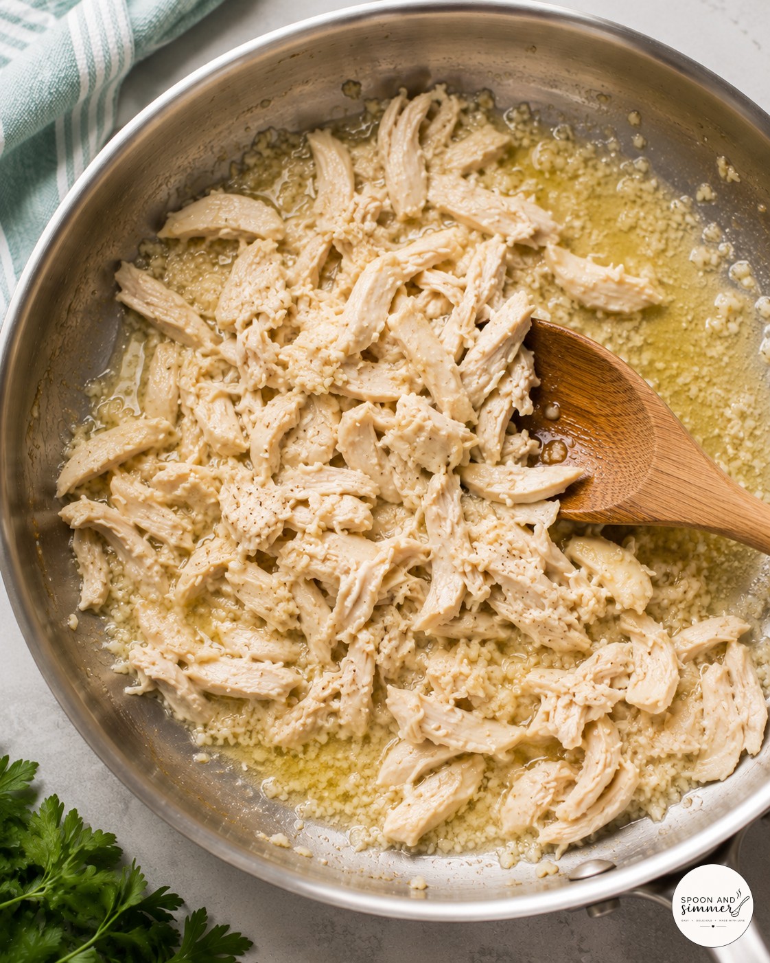 Onion and garlic sizzling in butter, the flavor base for white chicken skillet lasagna